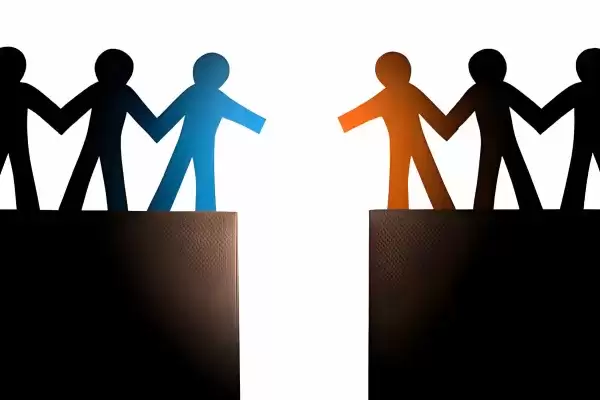 Graphic of Two groups of people different colors approaching each other 