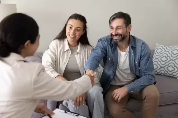 foster couple sitting with social worker