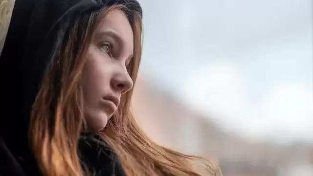 sad Teenager girl with long hair