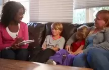 A foster family meeting with a case worker