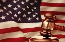 American flag with a judges gavel in front of it
