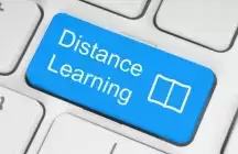 A blue key on a keyboard saying distance learning
