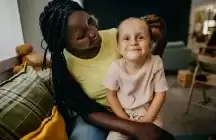Foster mom and foster daughter posing playfully for portrait smiling and being silly