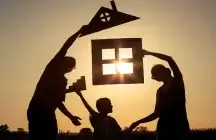 Family in Silhouette with shapes of a home