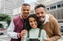 LGBTQ foster male couple with adopted girl