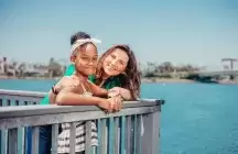 Foster mom and child on a dock 