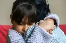 Foster Child, being hugged by a foster Mother