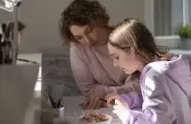 foster mom helping foster child with homework