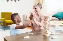 Foster child playing Ginger with a foster mom