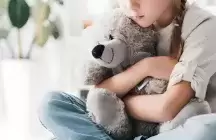 Child holding a teddy bear