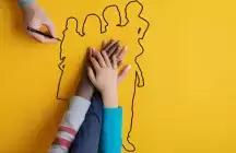three hands on a yellow piece of paper 