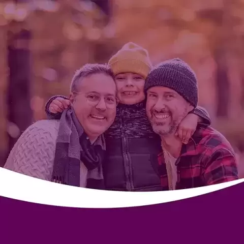 Two foster fathers with their child