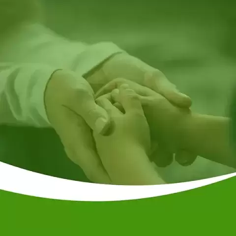 Foster parent and child holding hands