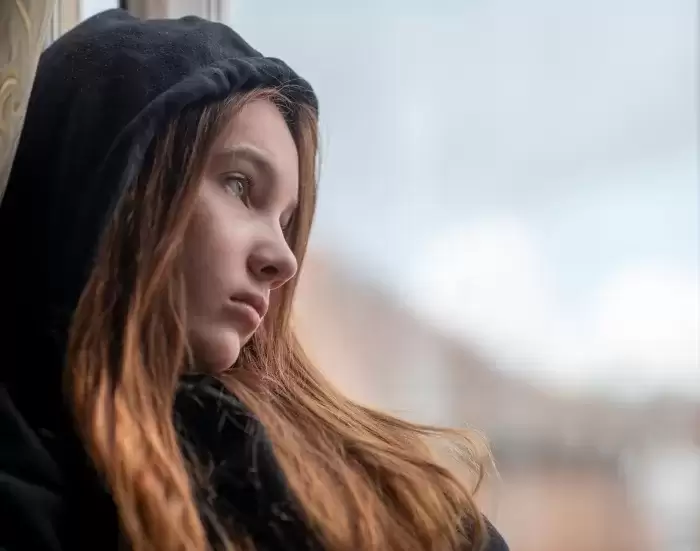 sad Teenager girl with long hair