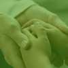Foster parent and child holding hands